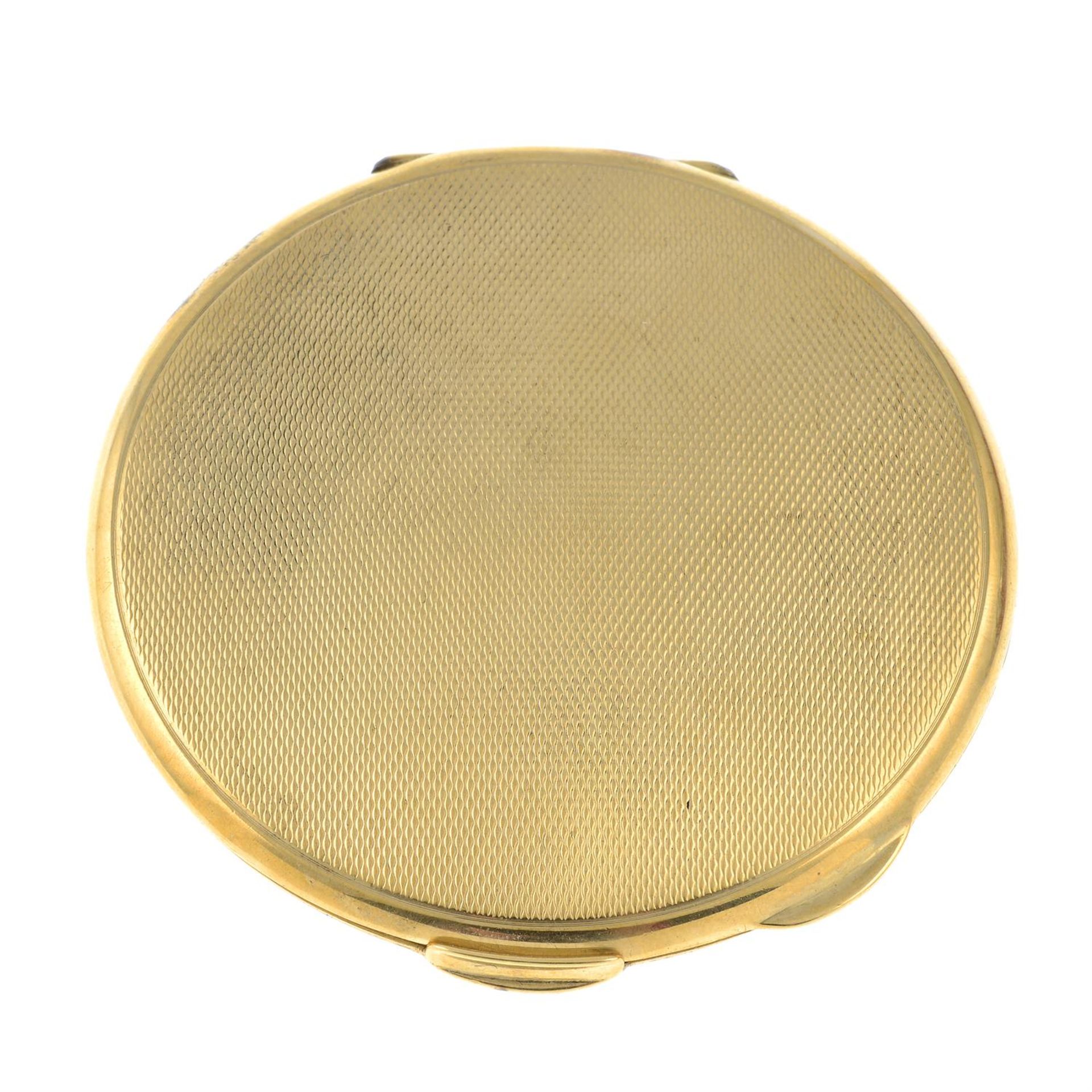 An early 20th century 9ct gold powder compact.
