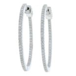 A pair of 18ct gold brilliant-cut diamond hoop earrings.