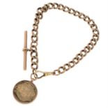 An early 20th century 9ct gold albert chain, suspending a T-bar and medal.