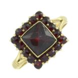 A garnet cluster ring.