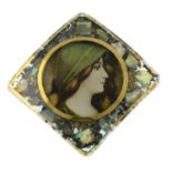 An Edwardian enamel and mother-of-pearl mosaic brooch, depicting a woman.