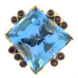 An 18ct gold blue topaz and purple sapphire cocktail ring, by Erwin Springbrunn.