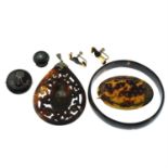 Six pieces of tortoise shell jewellery to include a pendant with elephant motif, two brooches,