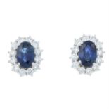 A pair of 18ct gold sapphire and brilliant-cut diamond cluster earrings.