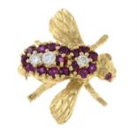 A ruby and diamond bee brooch.