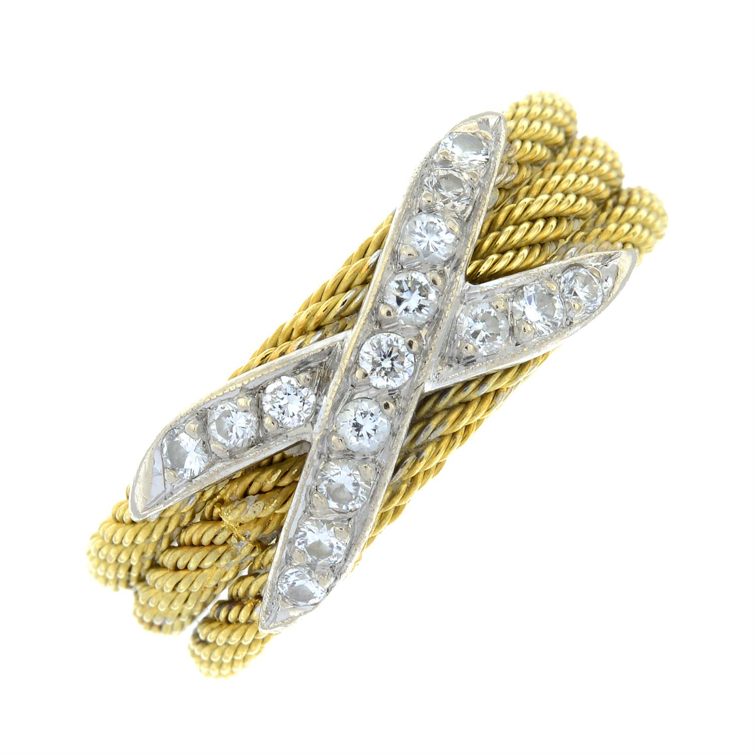 A rope-twist band ring, with pavé-set diamond cross highlight.