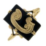 An onyx ring with the initial 'C'.