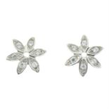 A pair of cubic zirconia flower stud earrings.