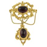 A 9ct gold cabochon garnet brooch.