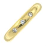 An 18ct gold diamond band ring, by Garrard.