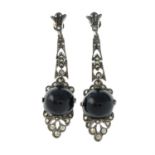 A pair of early 20th century silver onyx and marcasite earrings.