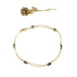 A 9ct gold sapphire bracelet and a mid 20th century 9ct gold diamond rose brooch.