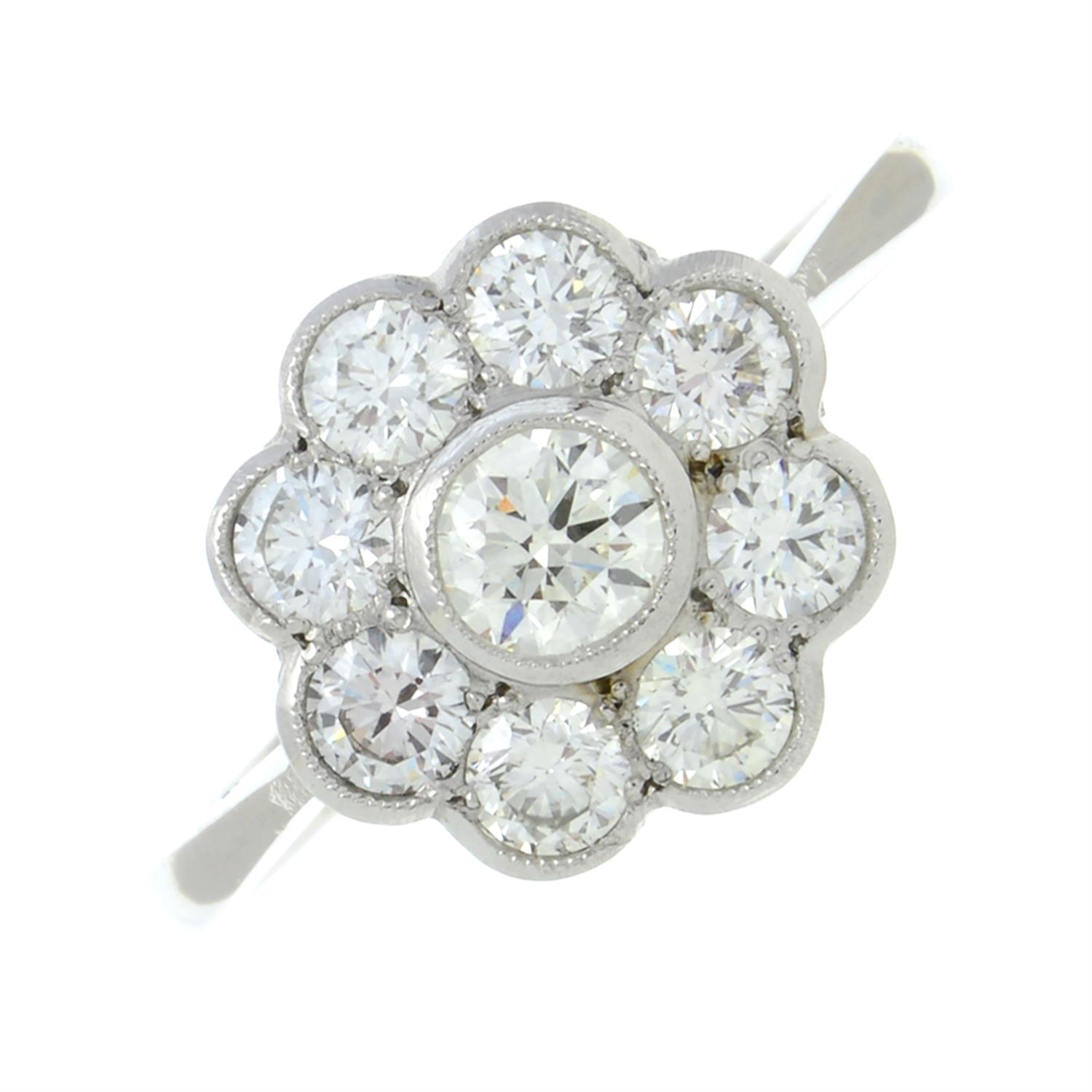 A brilliant-cut diamond floral cluster ring.