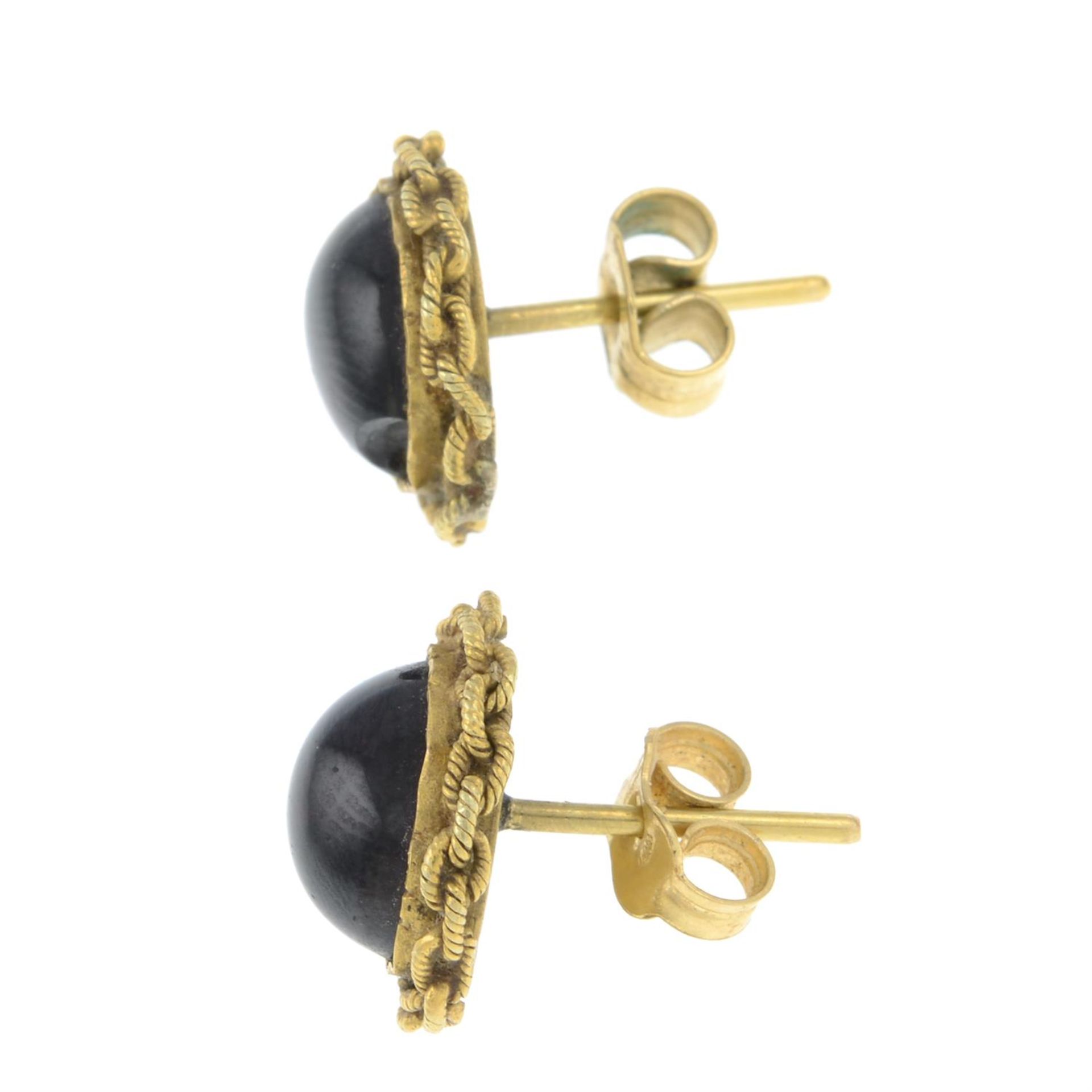 A pair of mid Victorian gold garnet cabochon stud earrings. - Image 2 of 2