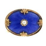 An early 20th century gold, blue guilloche enamel brooch, with split pearl highlight.