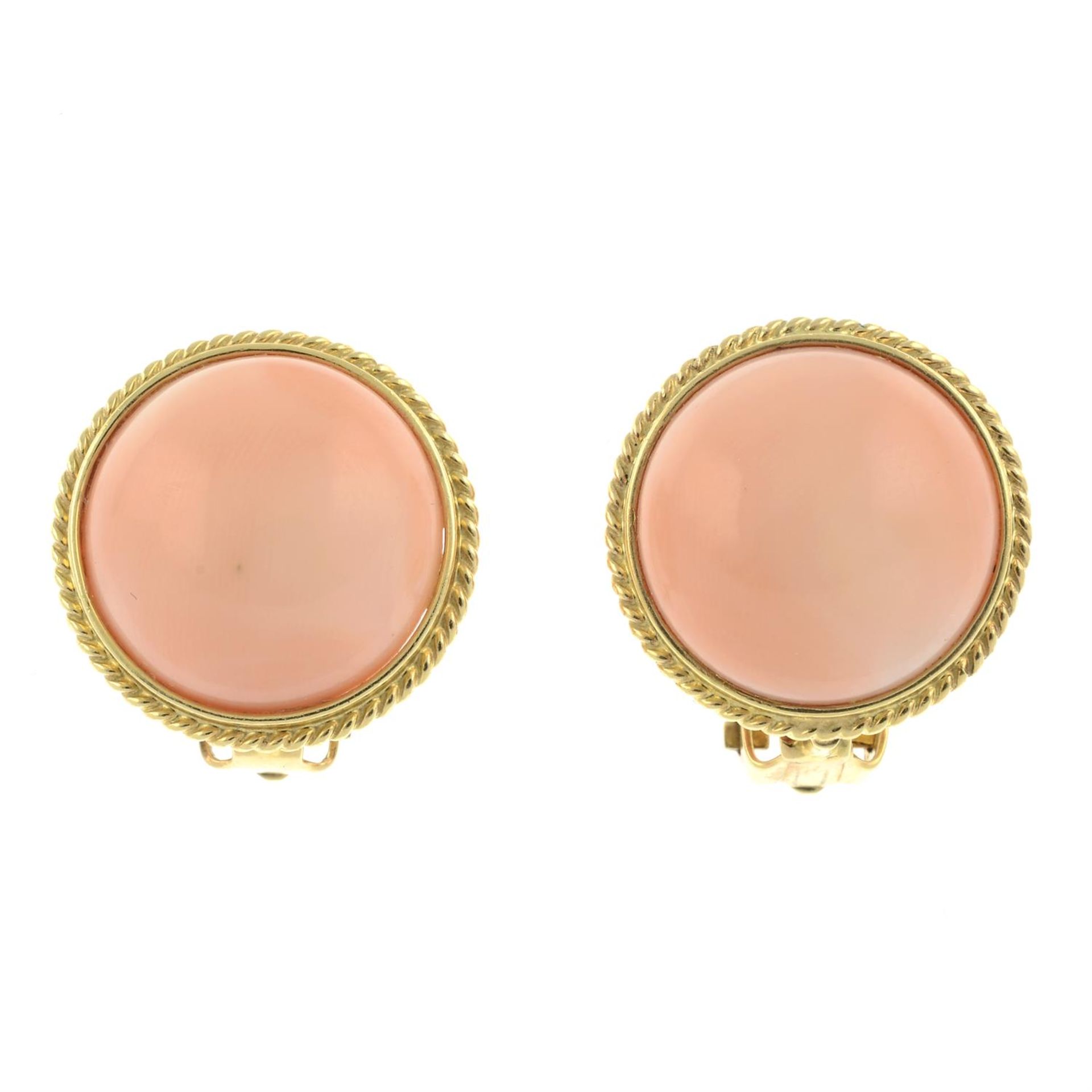 A pair of cabochon coral clip-on earrings.