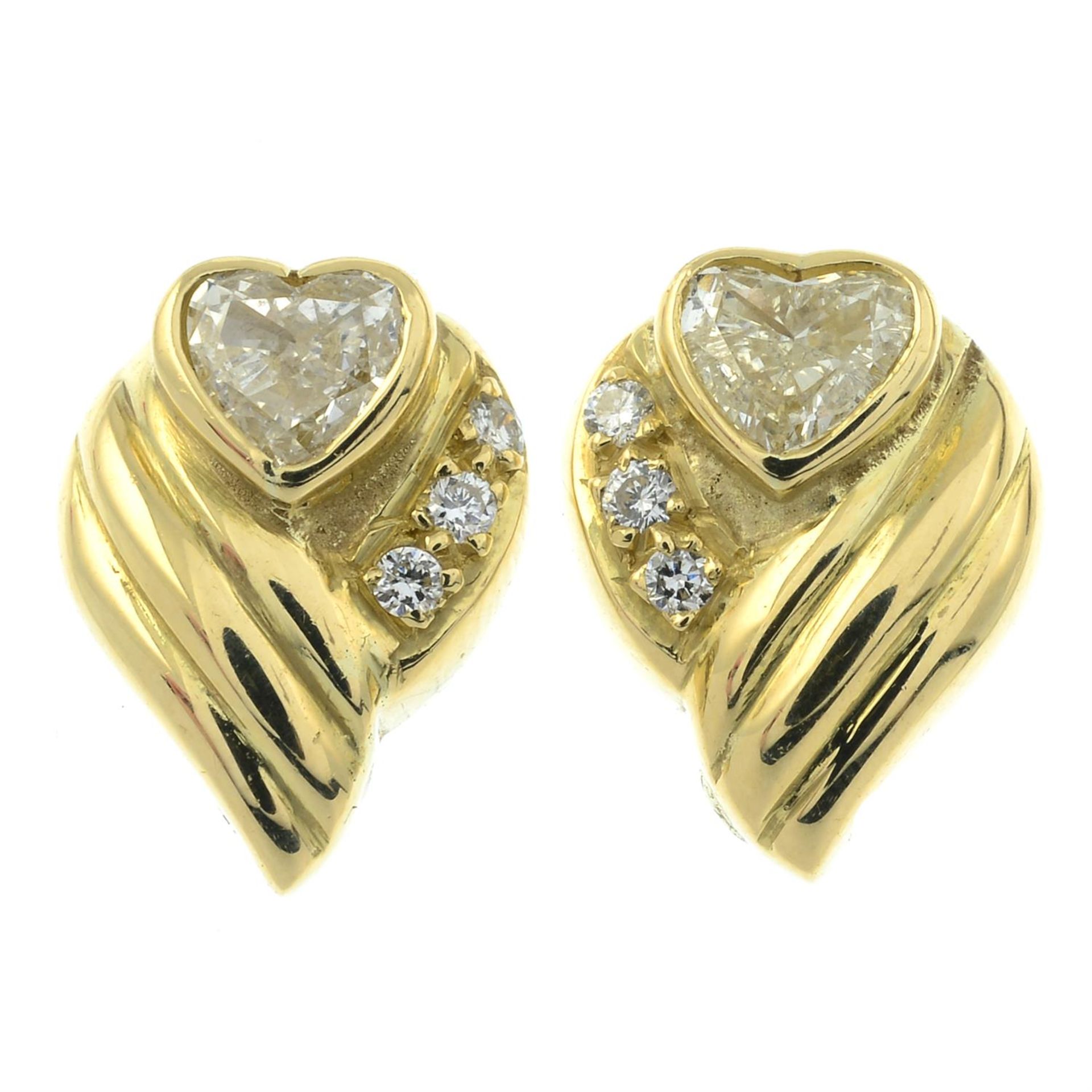 A pair of heart-shape diamond and brilliant-cut diamond earrings.