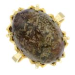 A hardstone cabochon single-stone ring.