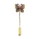 A gem-set and diamond butterfly stickpin.