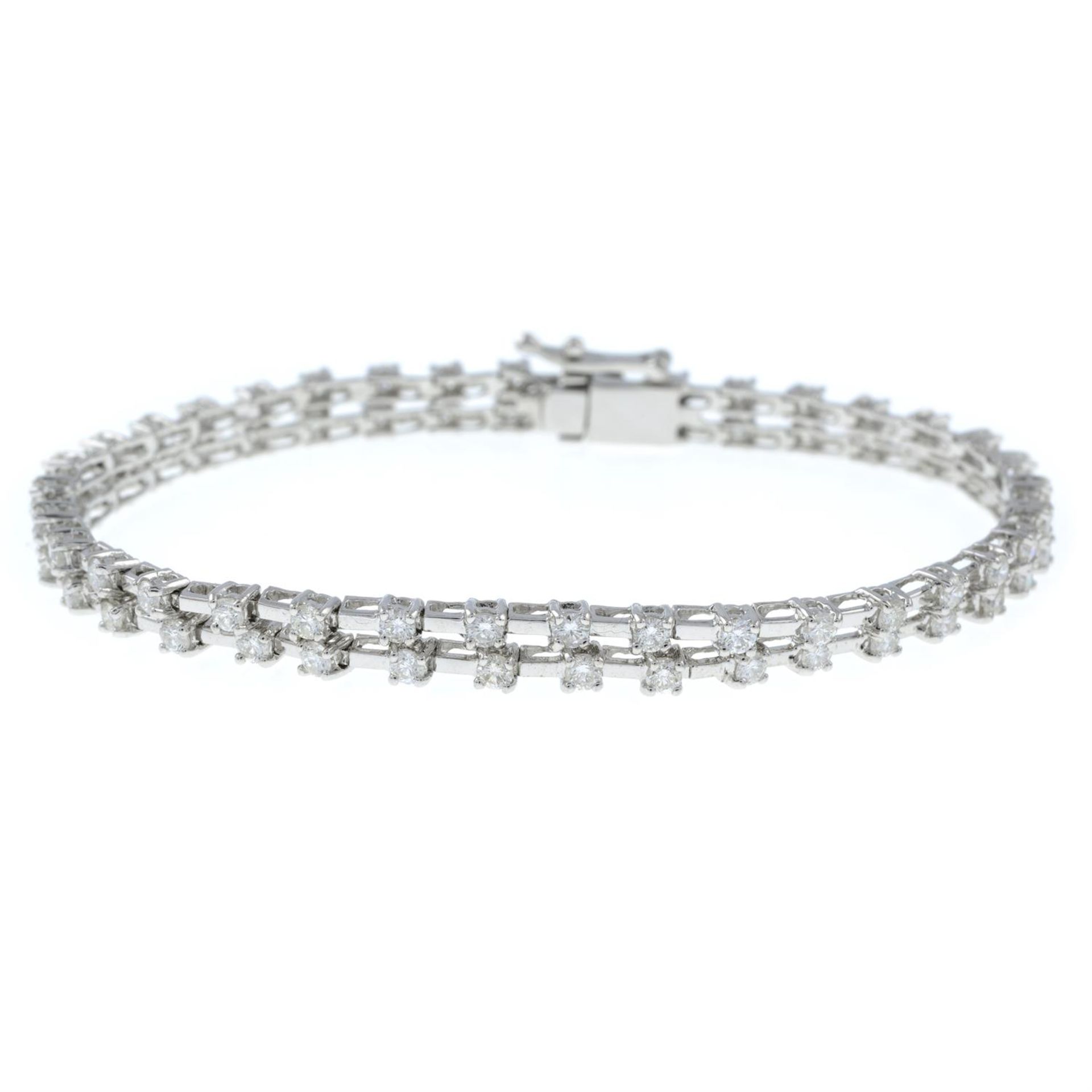 A brilliant-cut diamond double row bracelet.