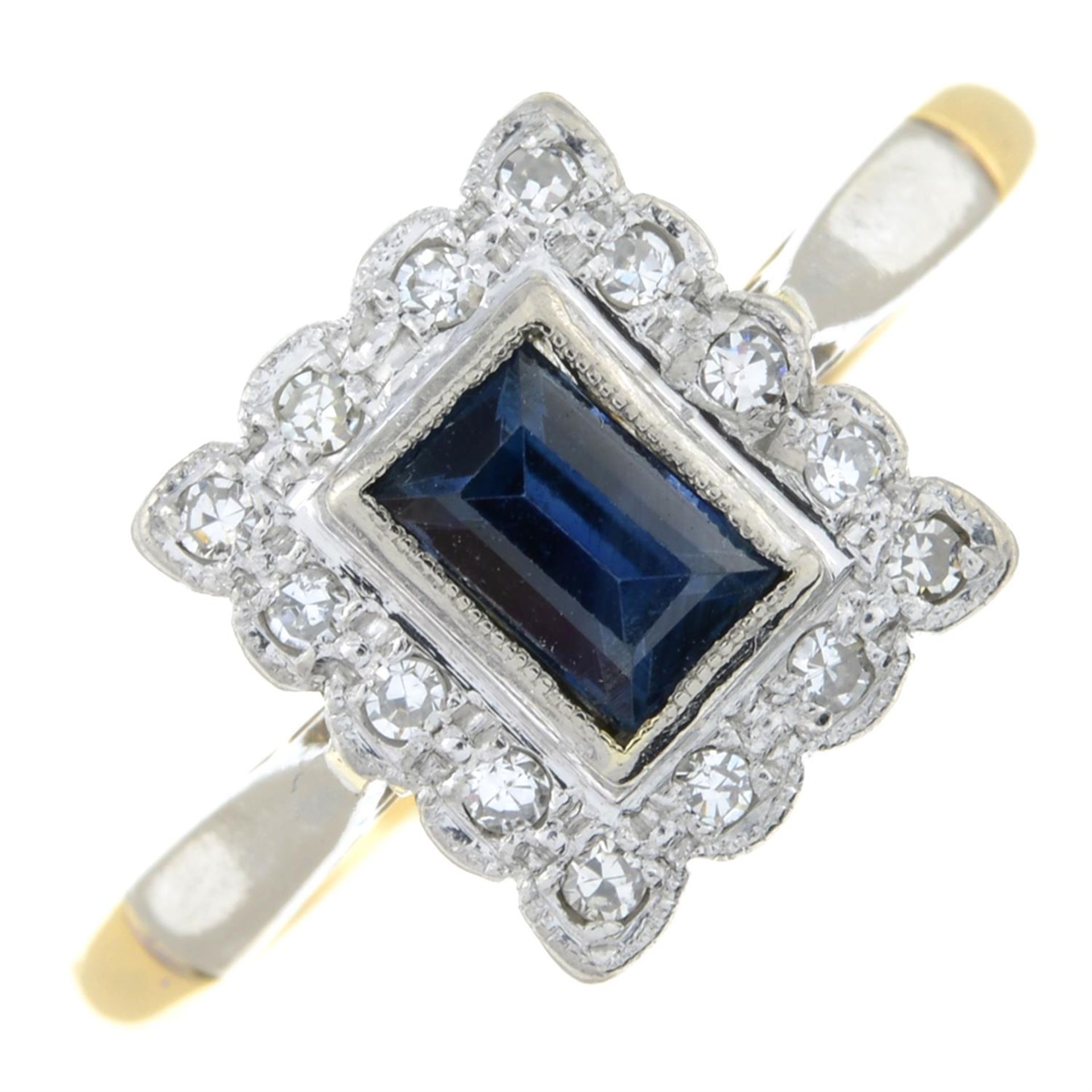 A sapphire and diamond cluster ring.