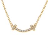 A pavé-set diamond 'Tiffany T - Smile' necklace, by Tiffany & Co.