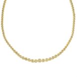 A 14ct gold graduated brilliant-cut diamond line necklace.