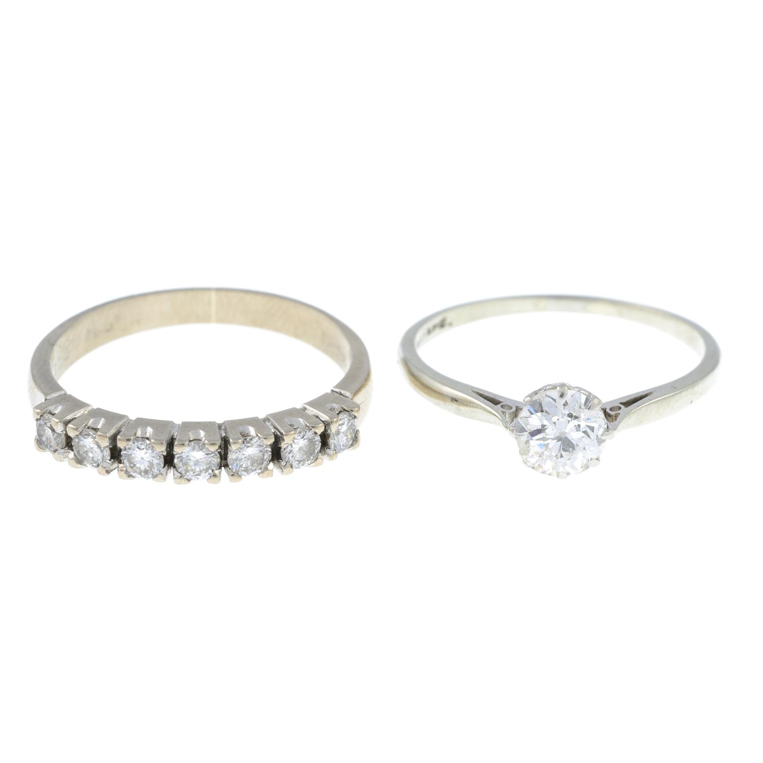 An old-cut diamond single-stone ring and a brilliant-cut diamond half eternity ring.