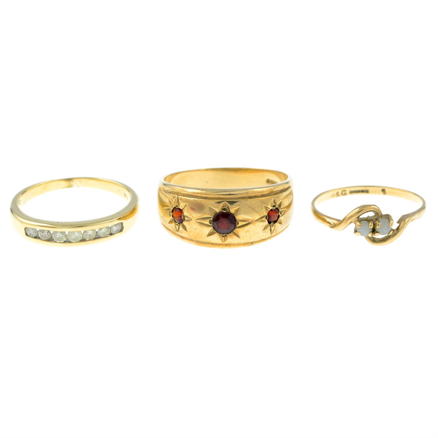 Three 9ct gold gem-set rings.