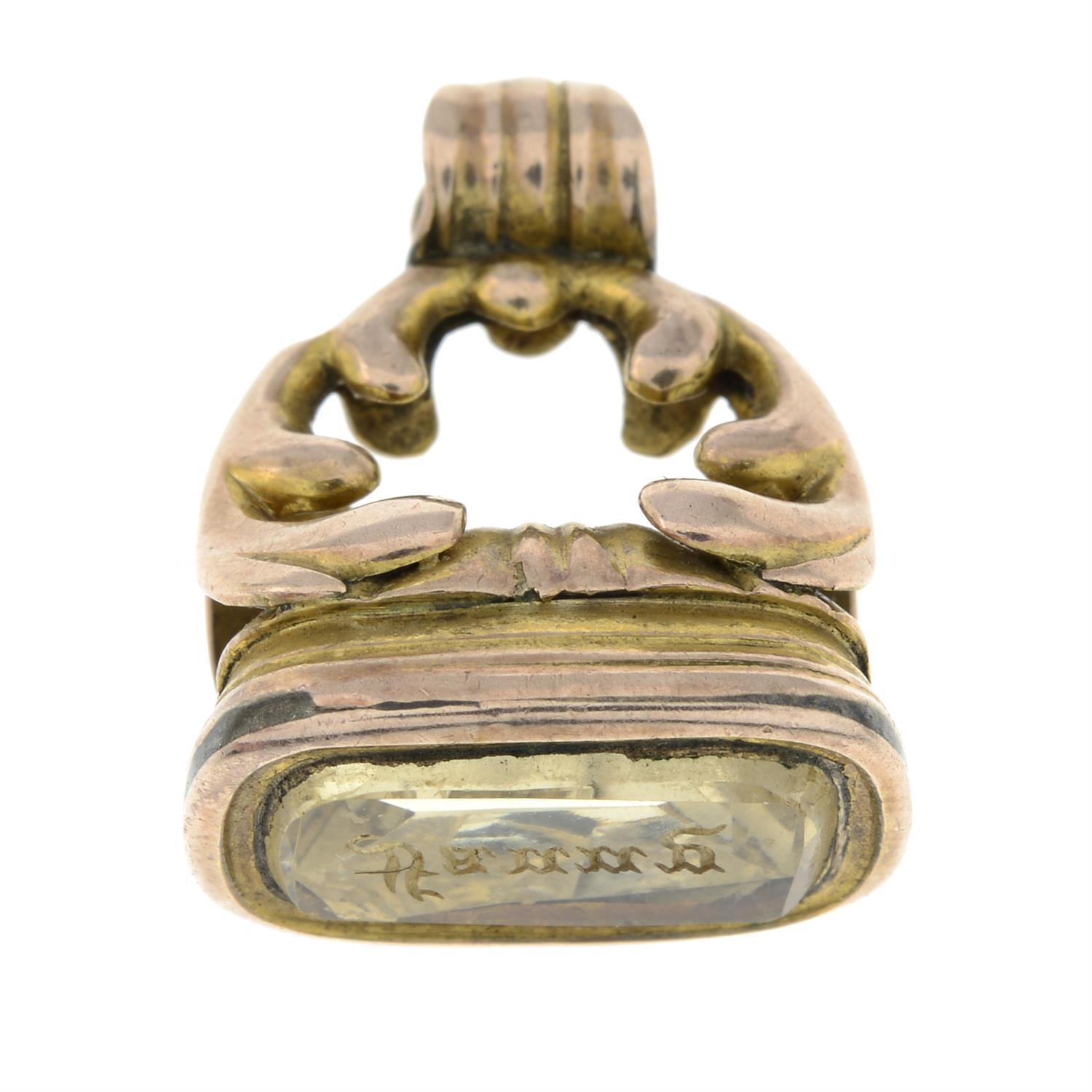 An early 20th century gold citrine intaglio fob seal.