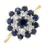 A sapphire and diamond cluster ring.