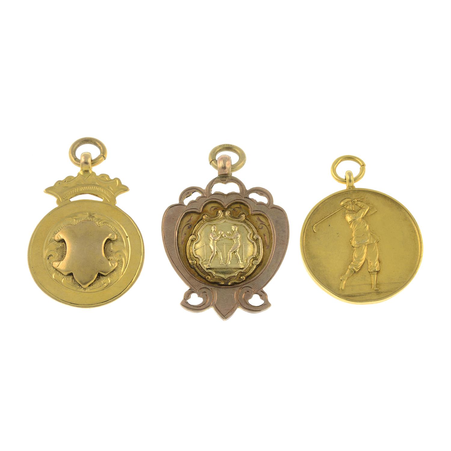 Three 9ct gold medallions.