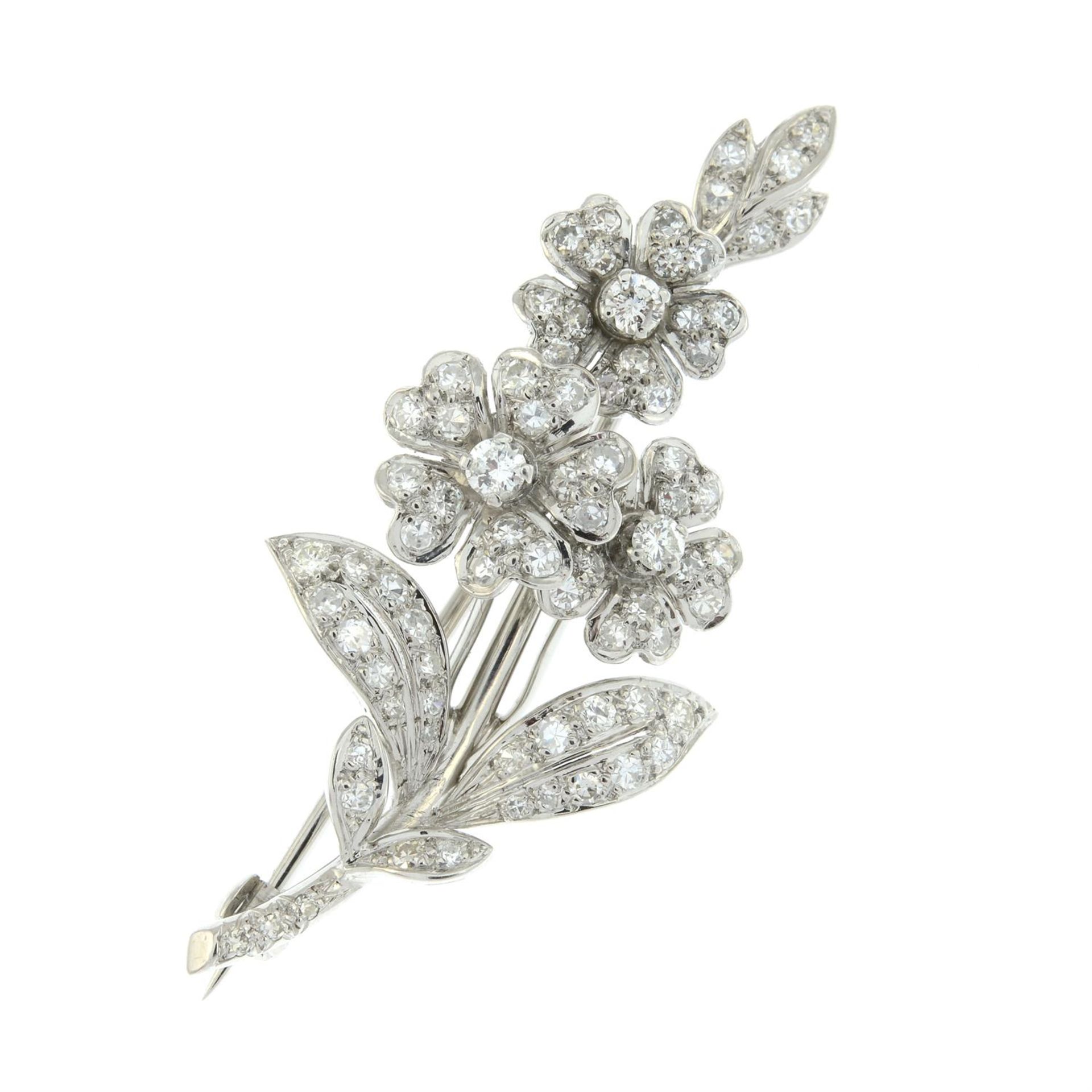 A mid 20th century gold, brilliant and single-cut diamond floral brooch, with Tessiers Ltd. case.