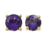 A pair of amethyst stud earrings.