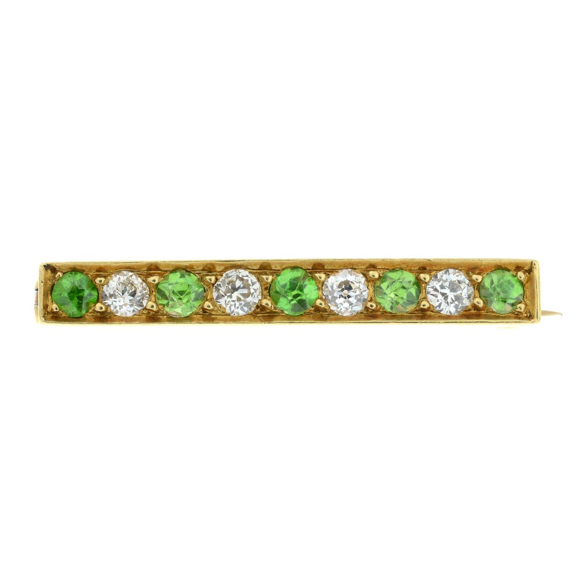 An early 20th century 18ct gold demantoid garnet and old-cut diamond bar brooch or lace pin.