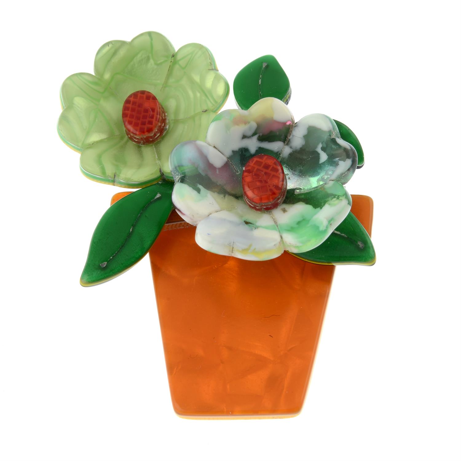 A plastic flower pot brooch by, Lea Stein.