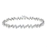 A brilliant-cut diamond collet bracelet.