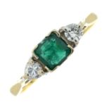 An 18ct gold emerald and diamond three-stone ring.