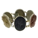 A late 19th century lava cameo bracelet, each panel depicting a lady in profile.