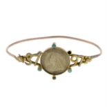 An early 20th century 9ct gold mounted silver threepence coin bangle, with turquoise and split