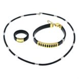 A jewellery set, to include a rubber bracelet with metal work panels, a rubber and diamond accent