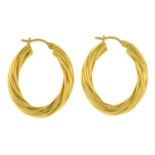 A pair of twisted hoop earrings.