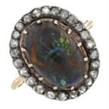 An early 20th century silver and 18ct gold, boulder opal and rose-cut diamond cluster ring.