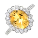 An 18ct gold citrine and diamond cluster ring.
