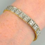 An early 20th century platinum and 18ct gold circular-cut diamond bracelet.