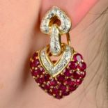A pair of ruby and brilliant-cut diamond heart earrings.