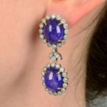 A pair of tanzanite cabochon and diamond floral cluster earrings, with foliate spacer.