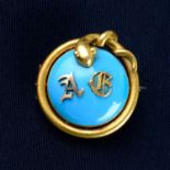 A late 19th century gold monogrammed blue enamel brooch, with snake surround and locket reverse.