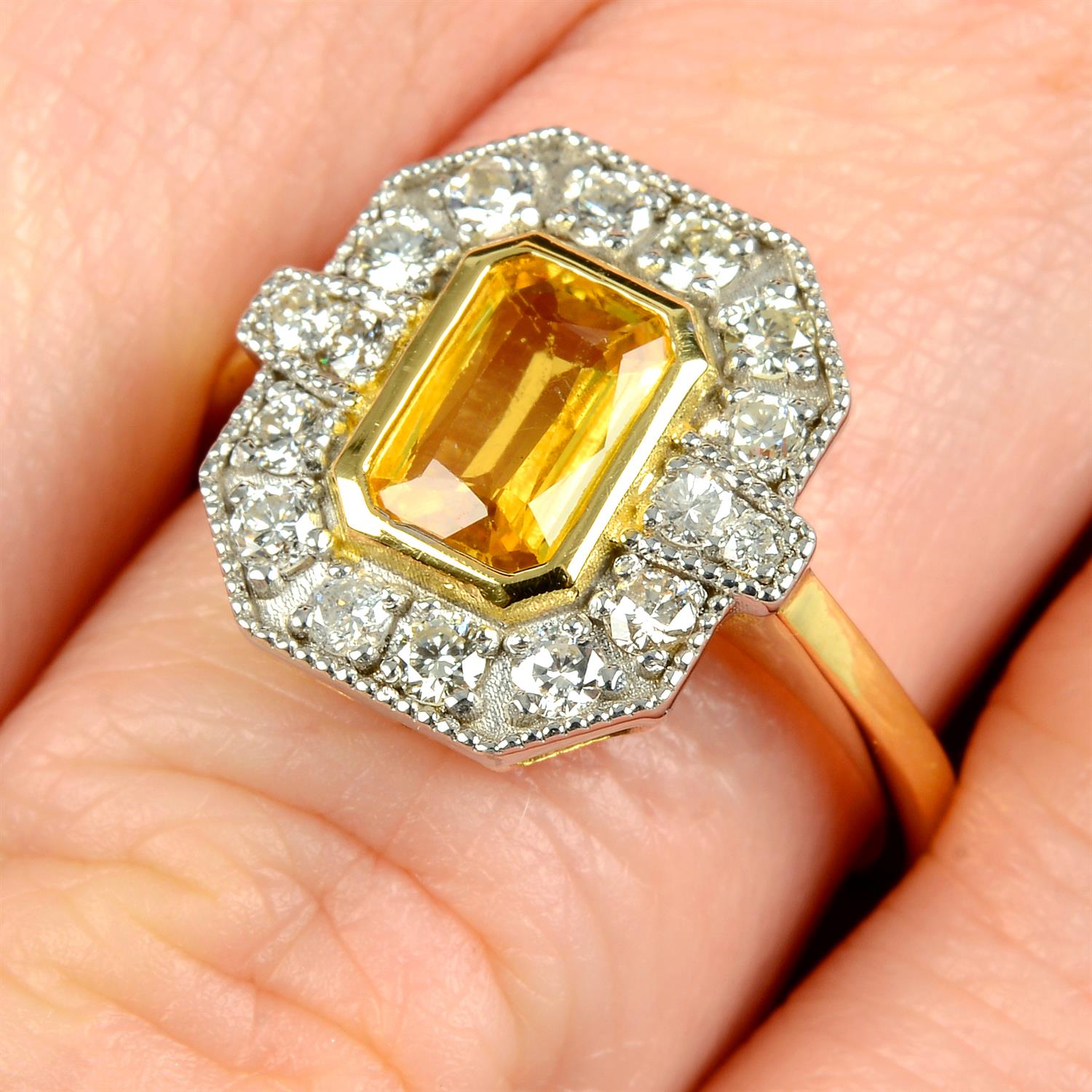 An 18ct gold yellow sapphire and brilliant-cut diamond geometric cluster ring.