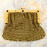 An early 20th century 18ct gold mesh coin purse, with sapphire and diamond highlights.